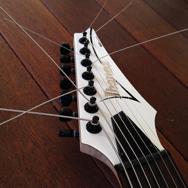 Stringjoy strings in an Ibanez headstock